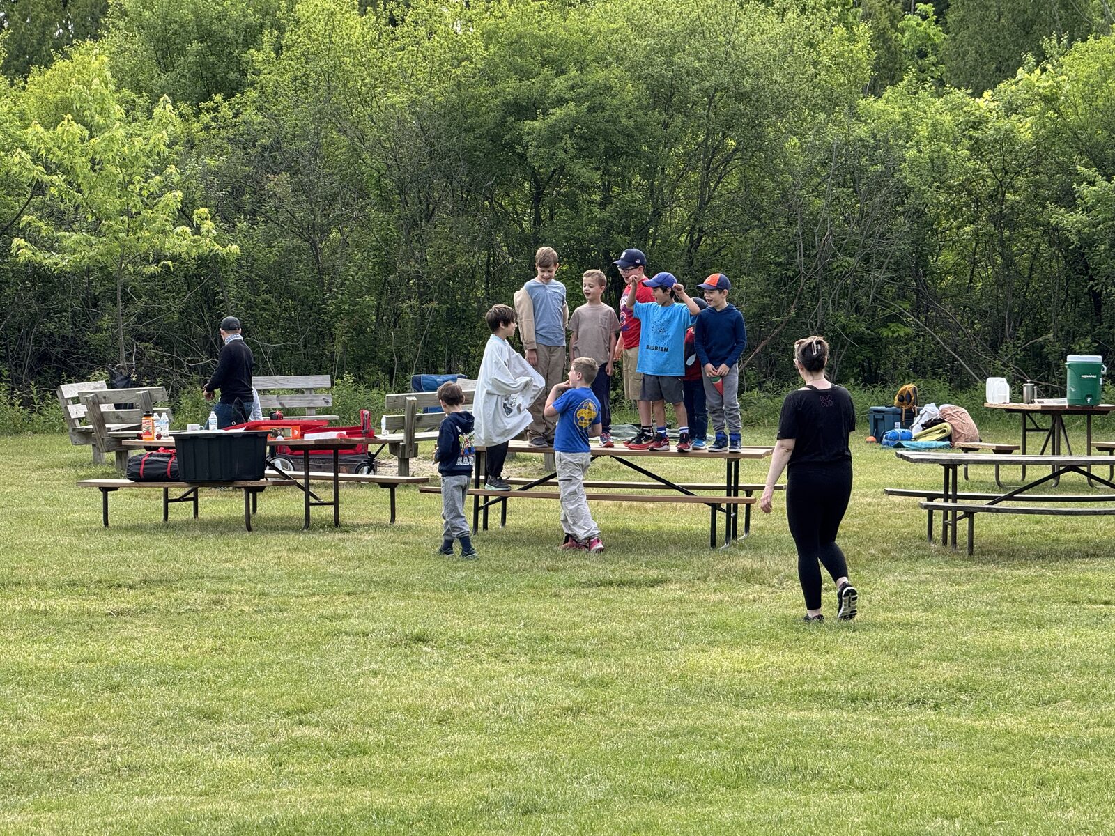 Scouts and families participating in a campground lawn activity